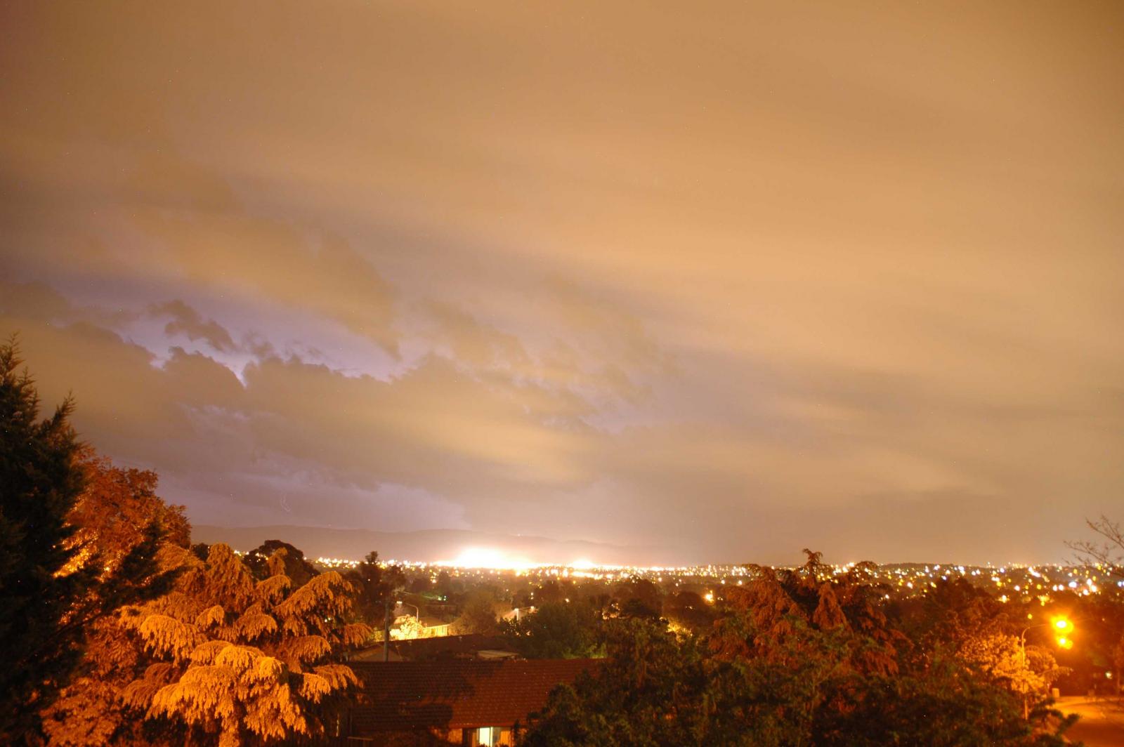 View from my balcony at night of distant lightning over Brindabellas